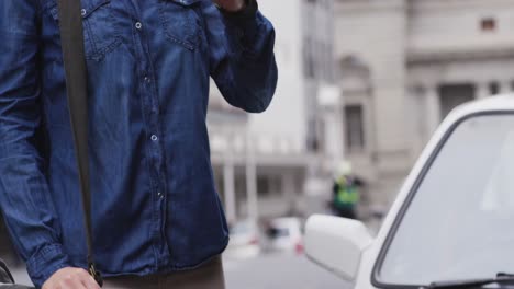 Front-view-of-Caucasian-woman-having-a-phone-call-and-wearing-coronavirus-covid19-mask