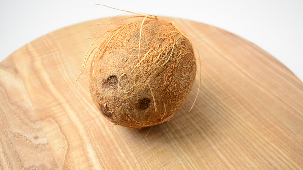 Shooting of coconut. Coco in a section, juice