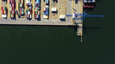 Container-ship-in-import-export-and-business-logistic,-By-crane,-Trade-Port,-Shipping-cargo-to-harbor,-International-transportation,-Business-logistics-concept,-Aerial-view