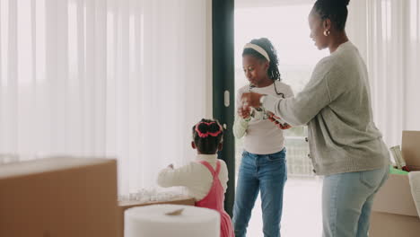 new home, mother or children packing boxes as