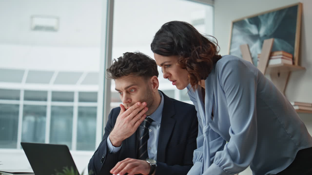 Two managers collaborating project strategy at office closeup. Team analyzing