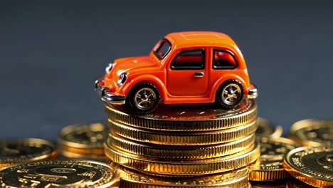 toy car on a stack of gold coins
