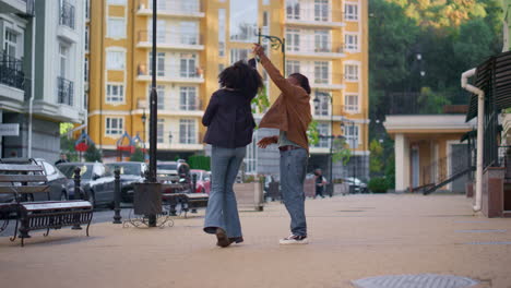 happy couple dancing street residential area together. gentle romantic relations