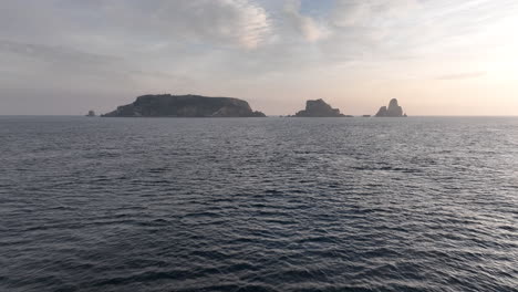 Aerial-approaching-Medas-Island-in-Catalonia-Costa-Brava,-flying-at-sunrise