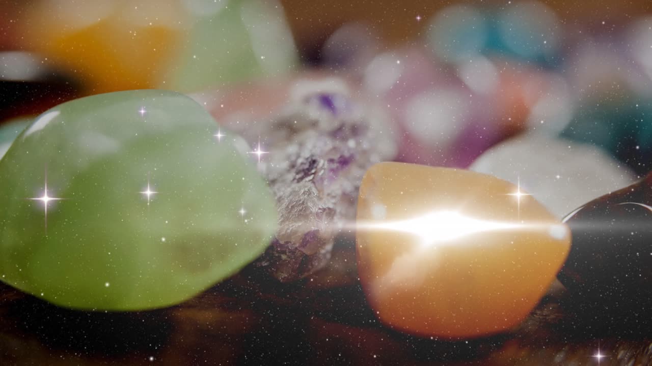 animación de estrellas y puntos de luz sobre piedras de colores