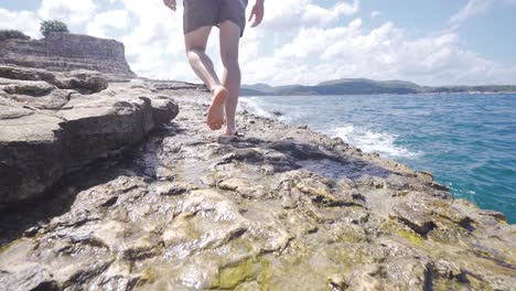 feet walking on the seashore.