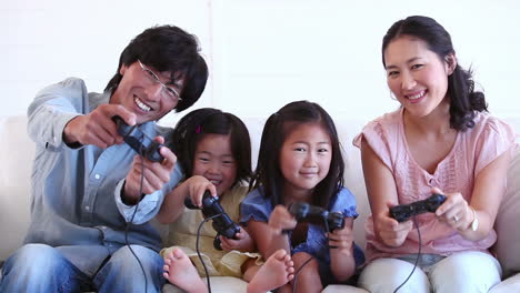 family happily playing a games console together