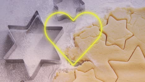 animation of neon heart over cookies dough and mold