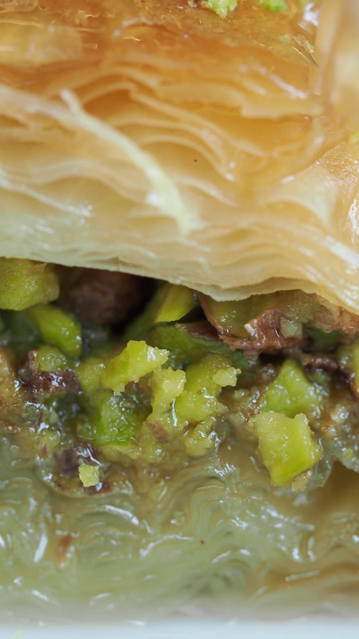 Close-Up of Delicious Pistachio Baklava with Golden Flaky Pastry