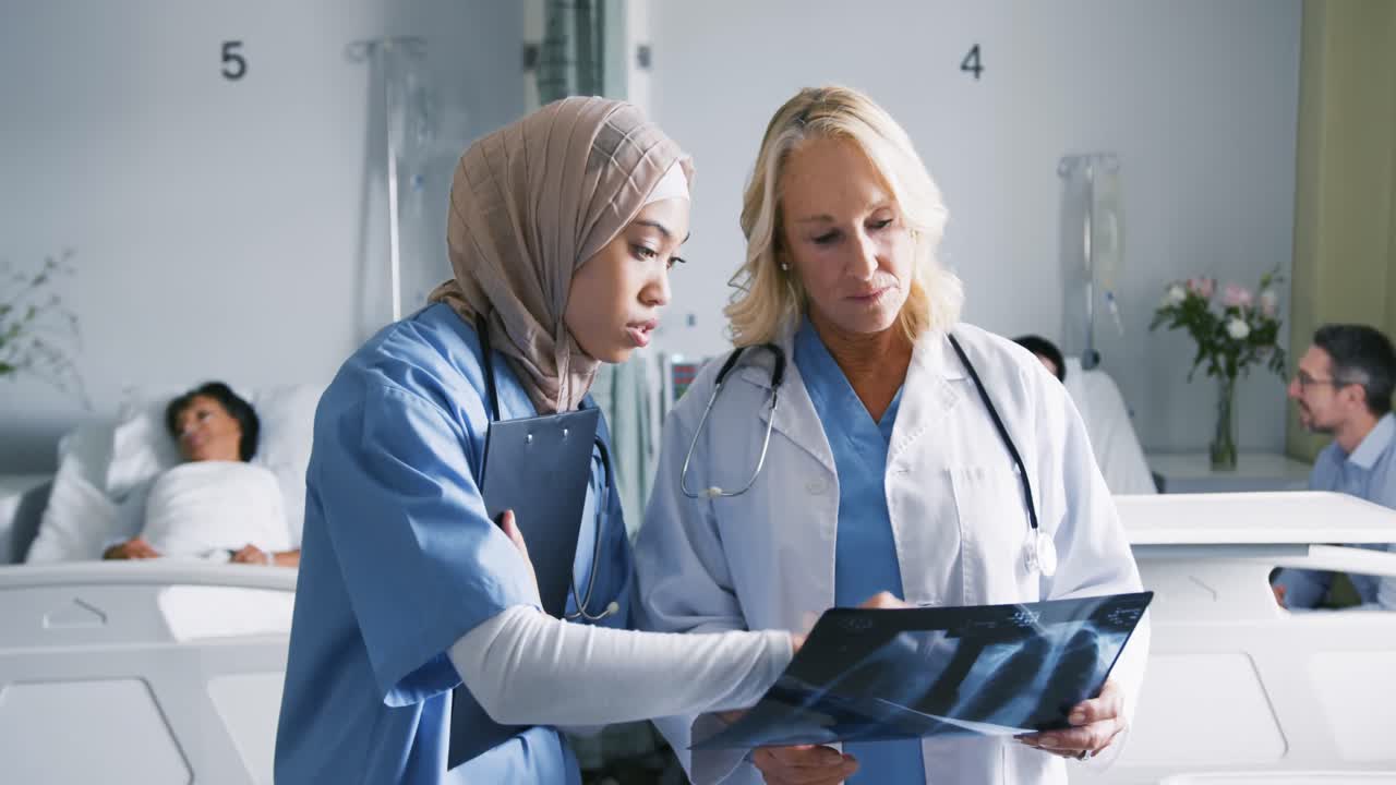 Two female doctors working together 4k