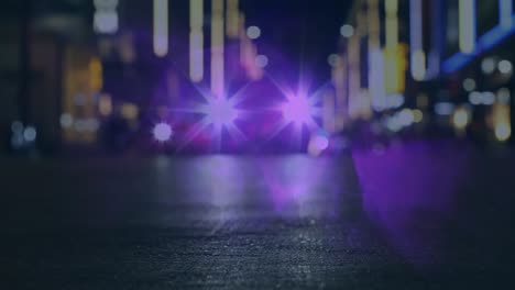 Animation-of-defocused-car-with-illuminated-headlights-moving-on-street-against-lens-flare-at-night
