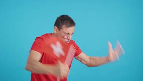 man cheering for switzerland, angry with the decision of referee