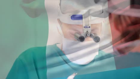 animation of flag of italy over surgeons in operating theatre