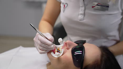 dentist check up teeth of young woman. woman at dentist having dental treatment at dentist office