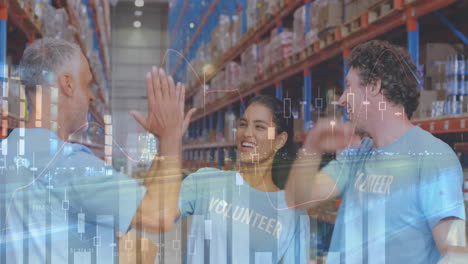 statistical data processing over male and female volunteers high fiving each other at warehouse