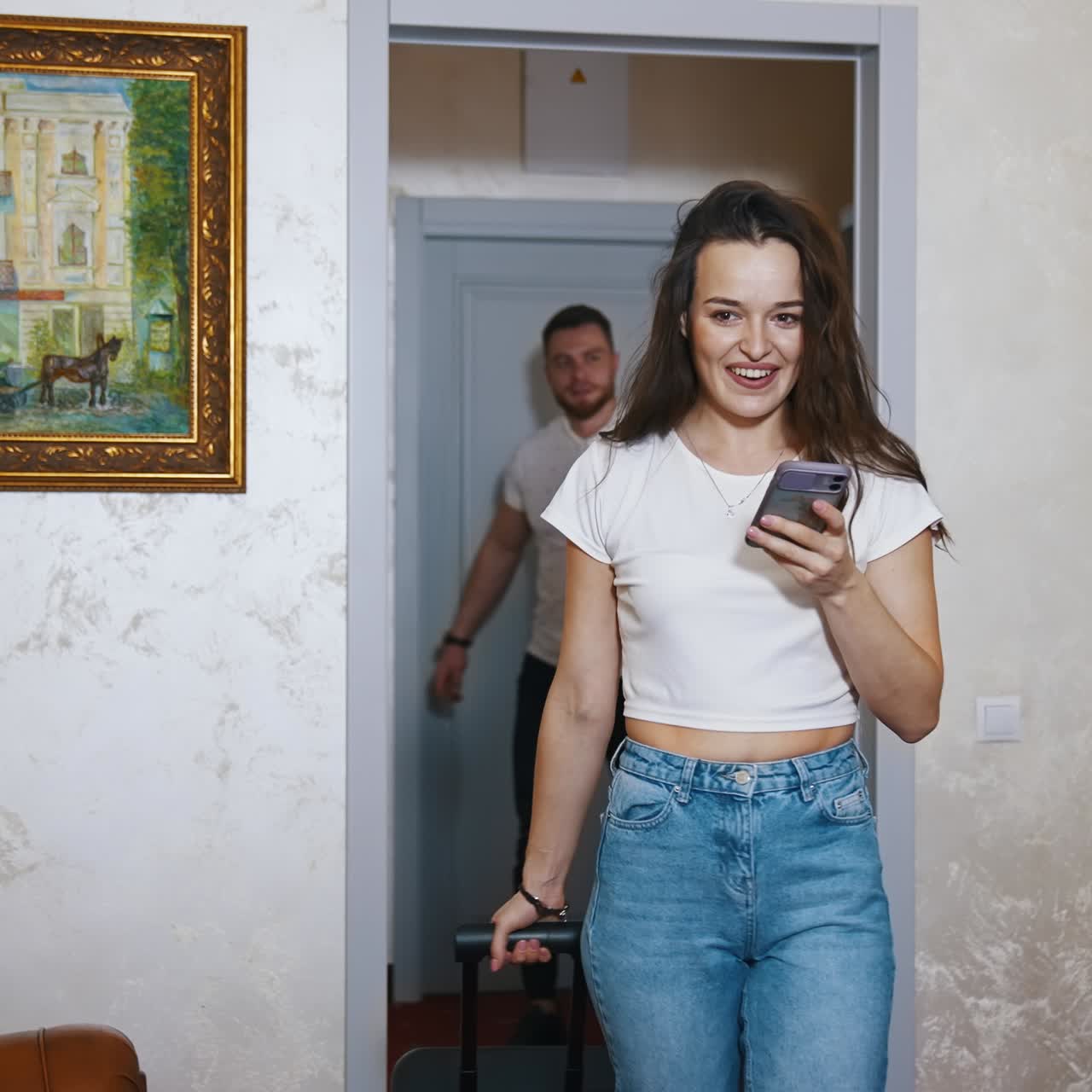 Young couple entering hotel room