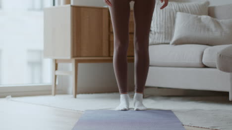 woman doing stretches at home