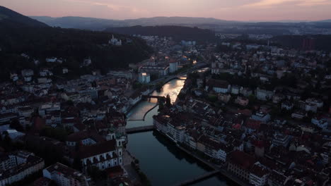 Aerial-view-of-the-soft-sunset-above-the-old-town-of-Lucern