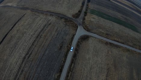 drone video: following the car on a lonely road