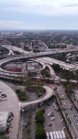 Vertical-Aerial-View-of-Interchange-Traffic-in-Downtown-Los-Angeles-USA-Area,-Harbor-and-Santa-Monica-Freeway-Junction-and-Beltway