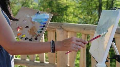 woman painting outdoors