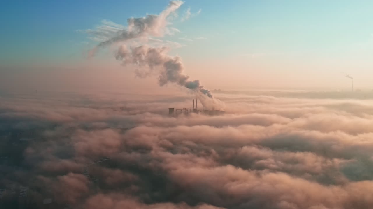 Cityscape of Bucharest from a drone, rows of residential buildings, thermal station with fog getting out and other the ground, ecology idea, Romania