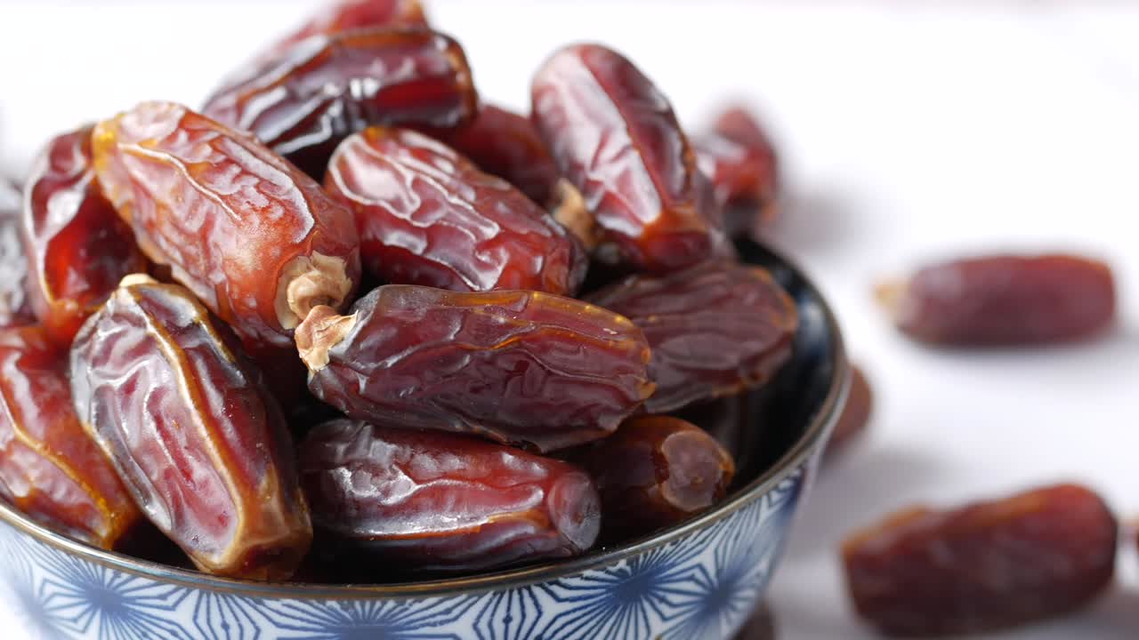 close up of fresh date fruit in a bowl on table