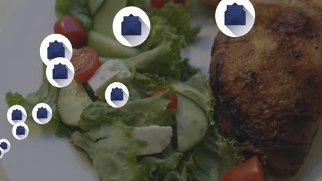 clipboard icons animation over salad with grilled chicken and vegetables