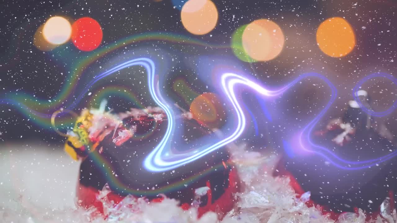 하 ⁇  입자가 떨어지고, 파란색 디지털 파동과 빛의 반점이 크리스마스 보블 위에 있습니다.