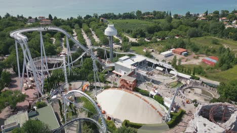 drone shot gardaland resort amusement park and roller coaster in italy