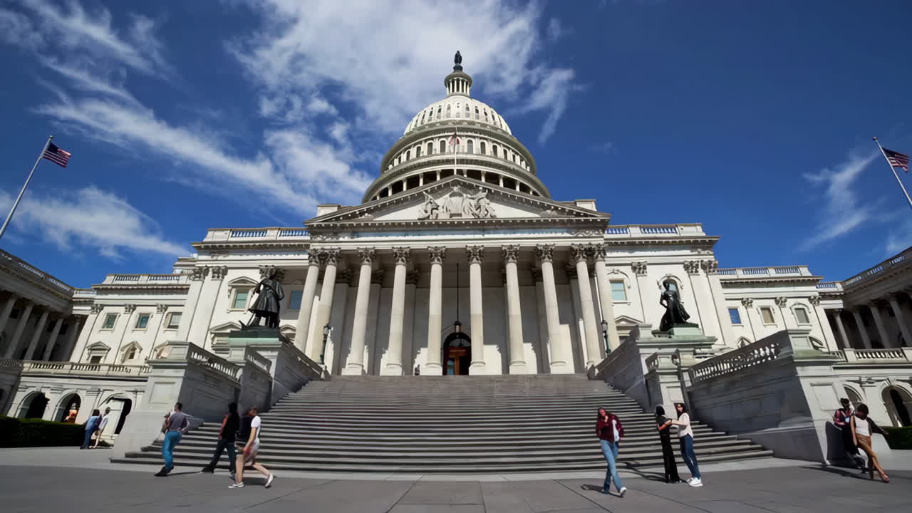 The United States Capitol Building under a blue sky
