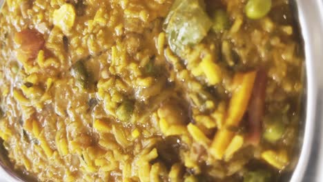 a close up shot of popular indian and asian lunch dish in a steel bowl