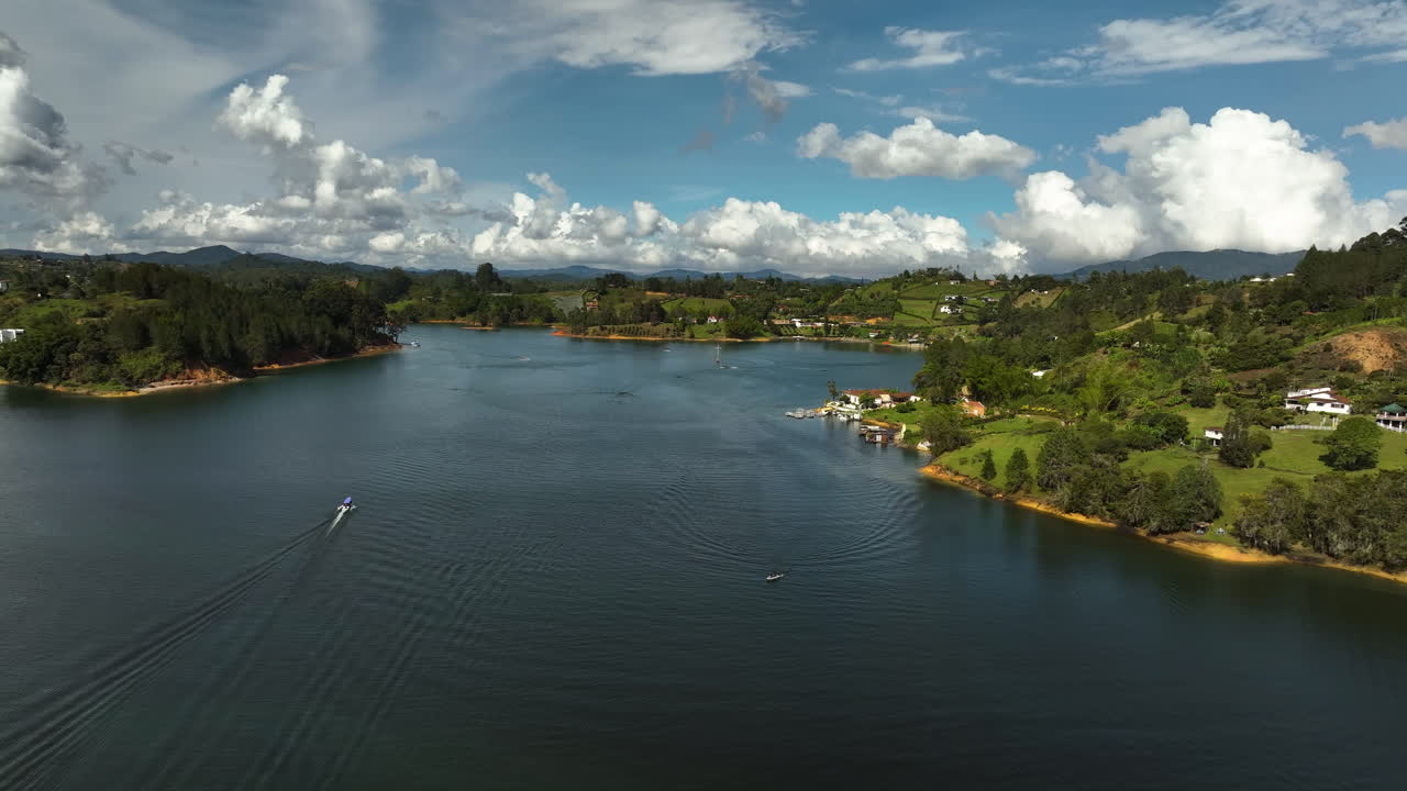 Aerial view approaching a cross on the lake at the Pe&ntilde;ol-Guatap&eacute; Reservoir in Colombia