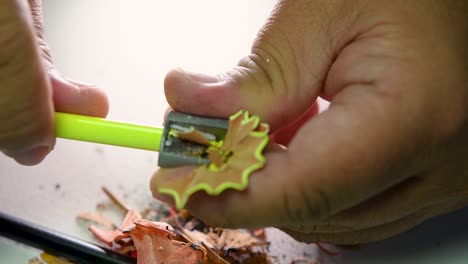 Footage-of-hands-slowly-sharpening-a-pencil-and-some-coloured-pencils-with-a-Wedge-Pencil-Sharpener