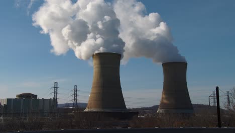 smoke rises from the reactor at the three mile island nuclear power plant