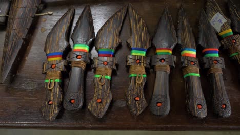 admire the exquisite artistry of decorative wooden weapons made from chonta wood