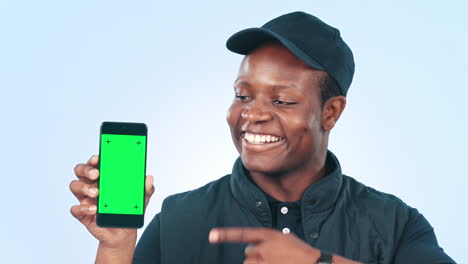 Happy-black-man,-phone-and-pointing-to-green