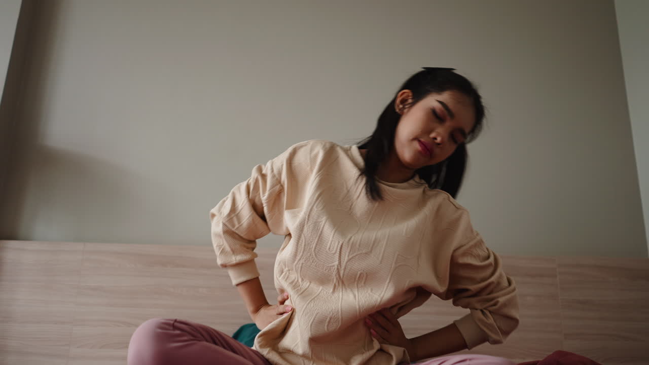 Woman stretching on bed
