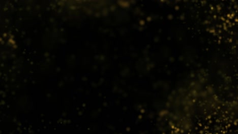explosión de partículas doradas en fondo negro. película en 4k.