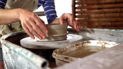 beautiful female potter making pot