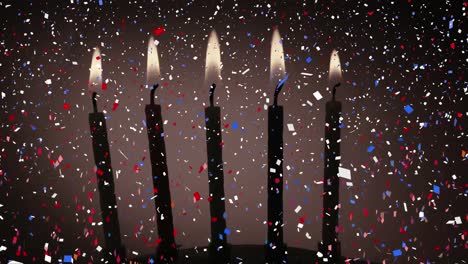 composición digital de confeti colorido que cae sobre velas encendidas contra un fondo gris
