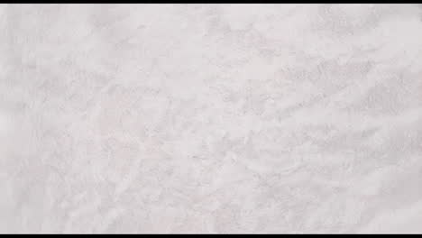 animation of gray shapes moving on white background