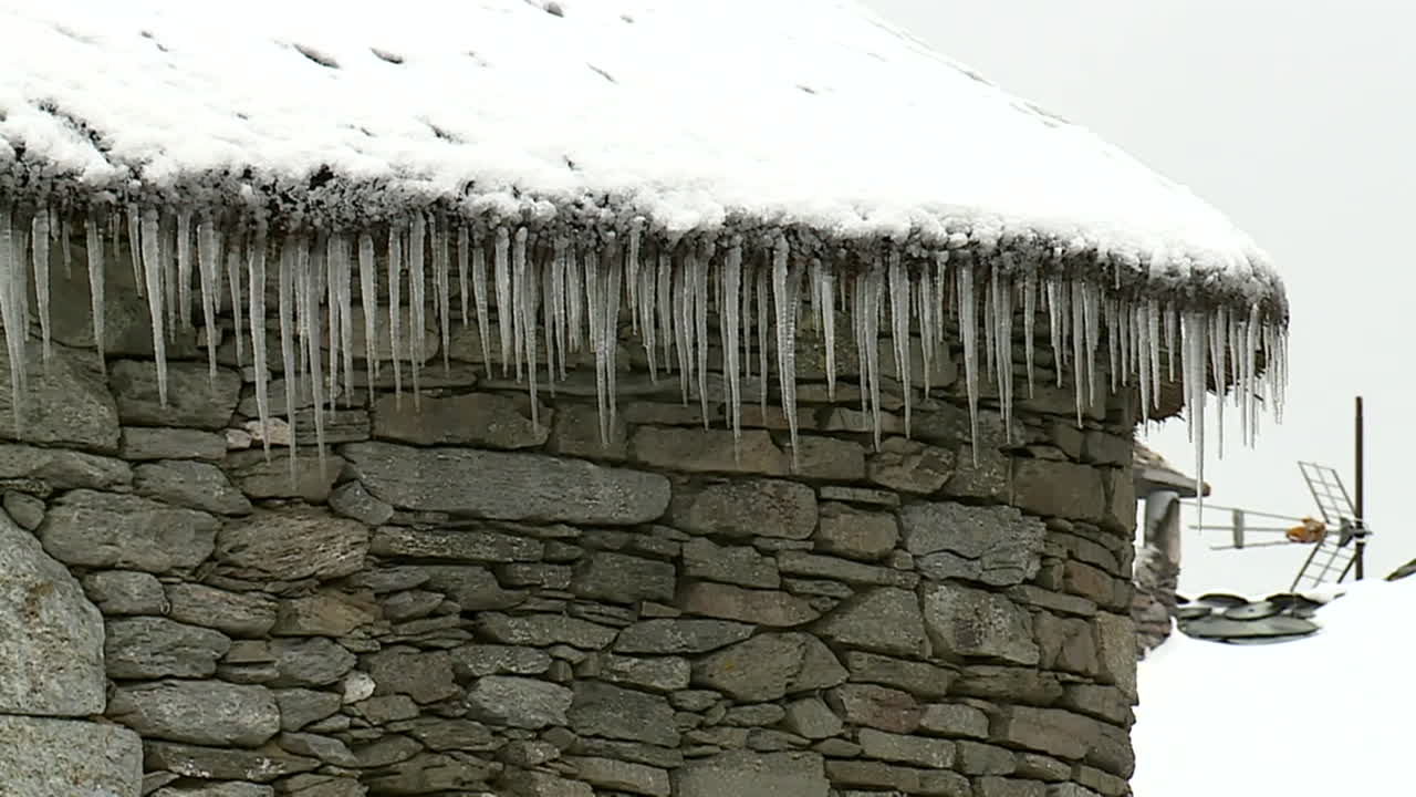Icicles on a Snowy Roof