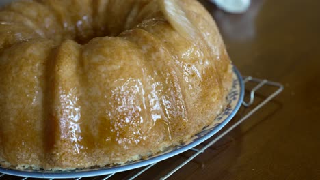 brushing a sugar glaze on a kentucky butter cake - pound cake series