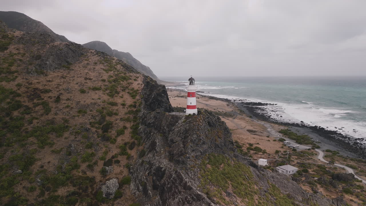 Aerial View of Lighthouse on Rocky Coastline, New Zealand