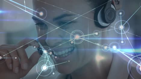 Animation-of-network-of-connections-over-businesswoman-wearing-phone-headset