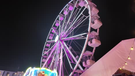 winter fairgrounds ferriswheel turning in night sky waterford city ireland