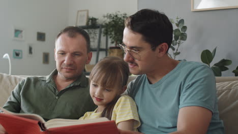 parents and kid reading book