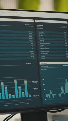 vertical video empty corporate workstations with computers running financial diagnostics