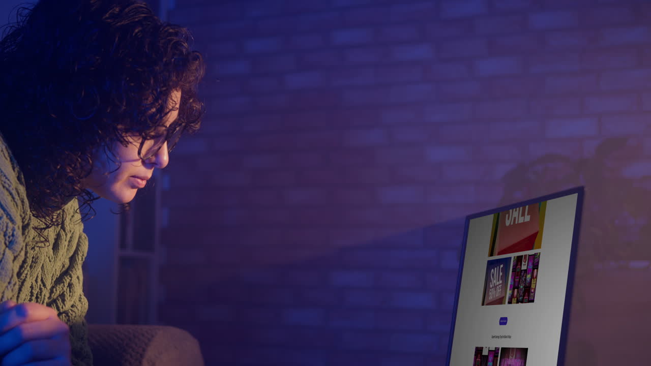Young Woman Browsing Online Sales on Laptop at Night